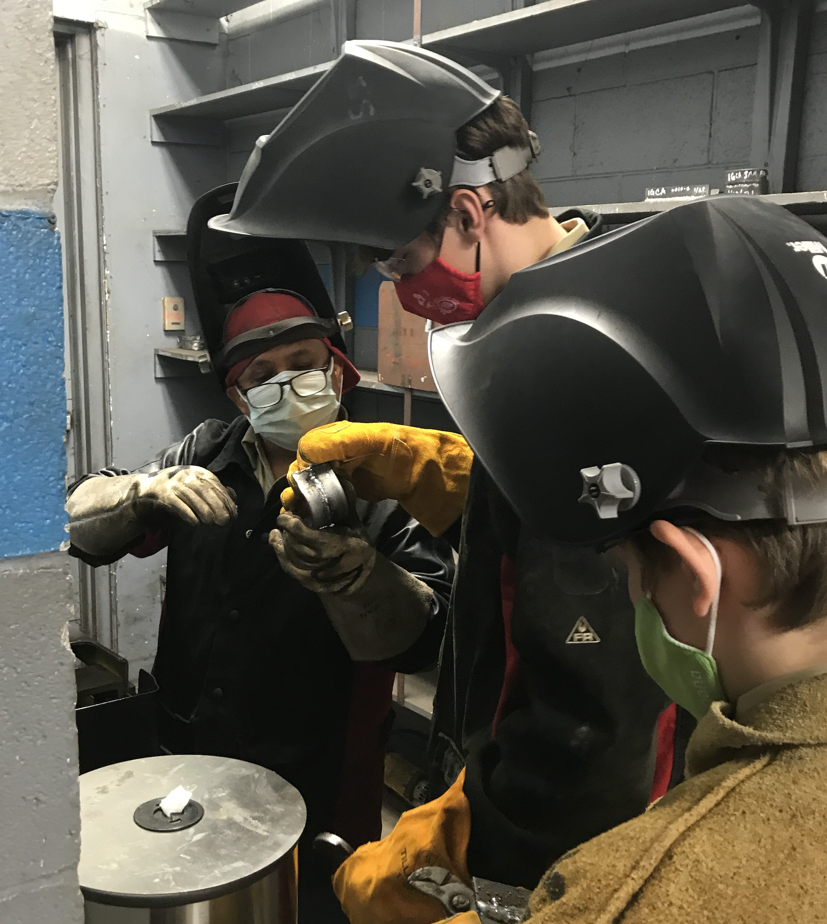 sanchez teaching boys scouts to weld