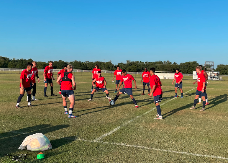 men's soccer doing drills