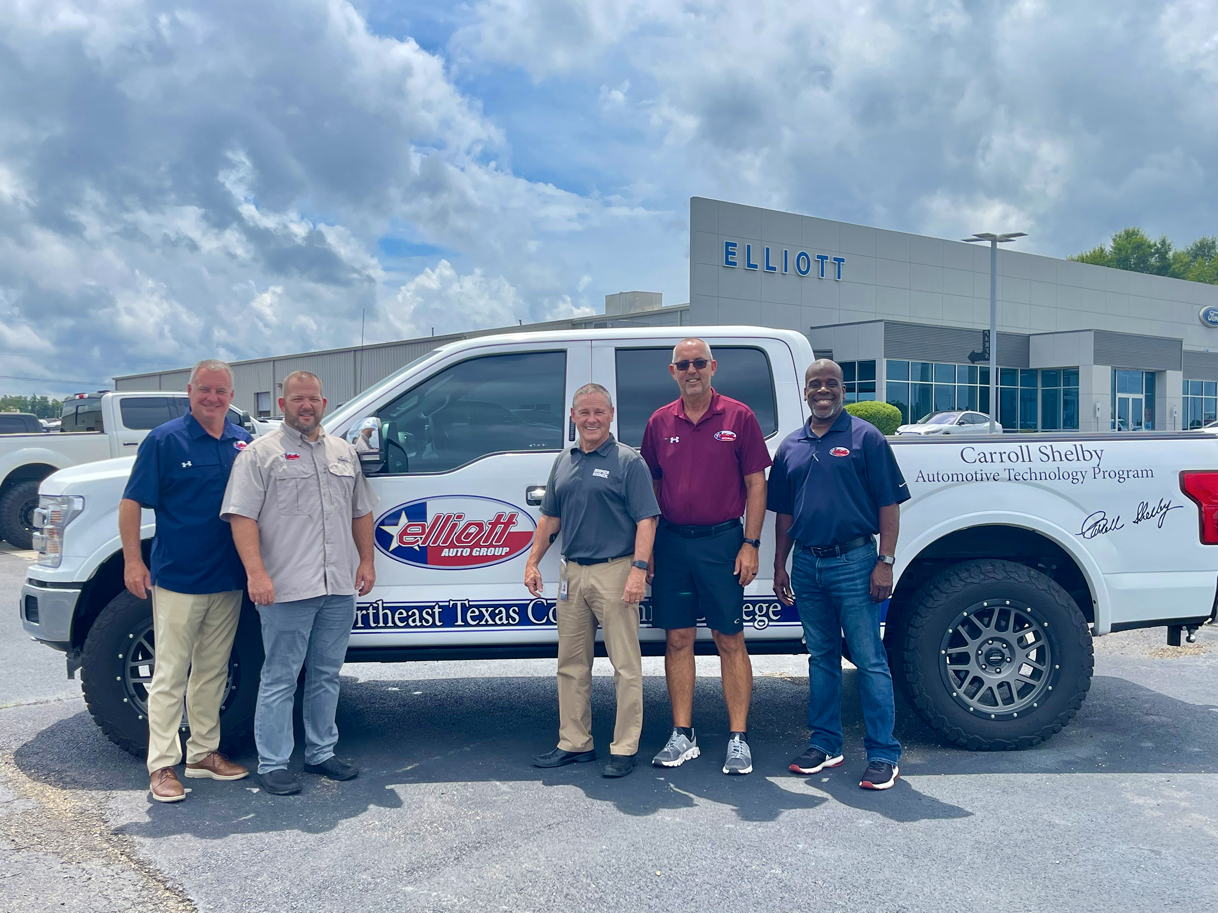 Elliott employees presenting truck