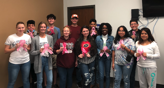 PTK students with pink ribbons