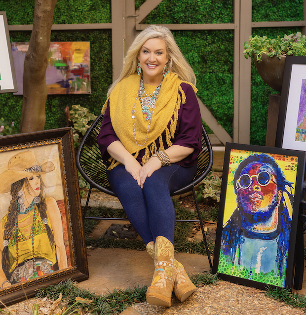 artist with her paintings