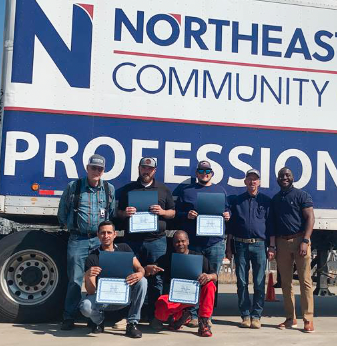 cdl graduates in front of truck