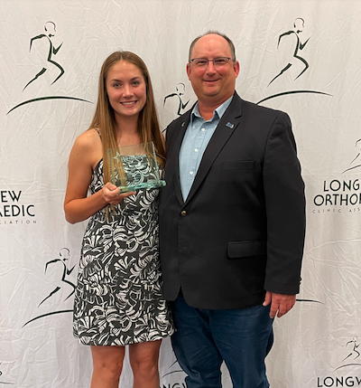 Zoe holding award with Justin Hargrove