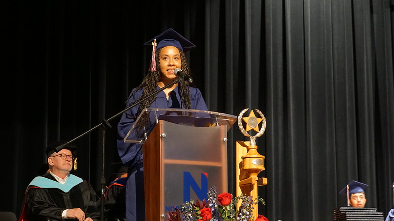 Courtney Baldwin speaking at graduation