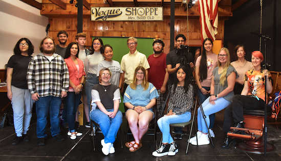 group of students involved in film project posed. 