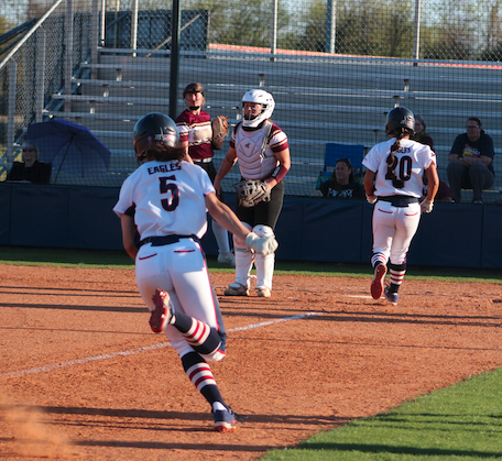 Pictured: Haley McAlexander (5) scoring one of her five runs on the day.