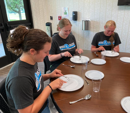 students learning table manners