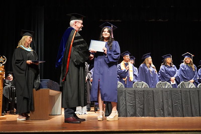 graduate getting diploma