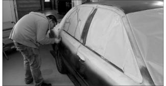 Autobody student working on car