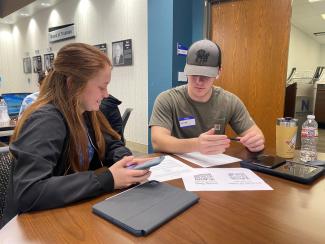 students judging with papers