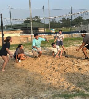 students playing volleyball