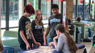 students at booth