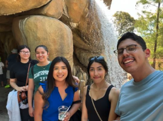 Students in front of waterfall