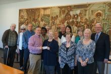 Retired teachers present check