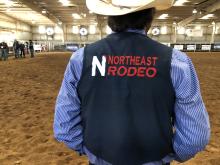 rodeo athlete wearing logo vest