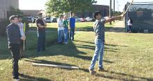 students throwing spears