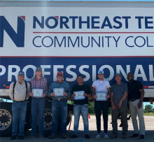 cdl graduates in front of truck