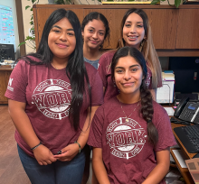 Work4college girls in matching shirts. 