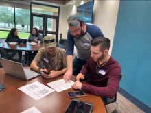 Dr. Drew Murphy assists students with judging. 