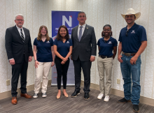 Nathaniel Moran with NTCC students and president