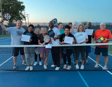 pickleball graduates at net