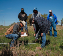 ranchers learning in a field