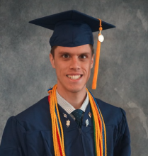 Luke McCraw in graduation regalia