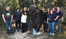 students with bigfoot statue